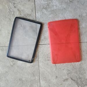 2 iPad mini cases 8.5" × 5.5" One orange soft-sided. One clear with a black rim